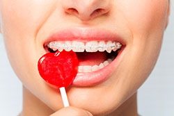 A person eating a lollipop.